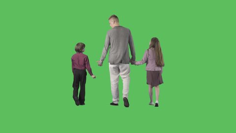 Young father is walking with children from the camera. Camera is static. Lens 85 mm. Footage with alpha channel. File format - .mov, codec PNG+Alpha