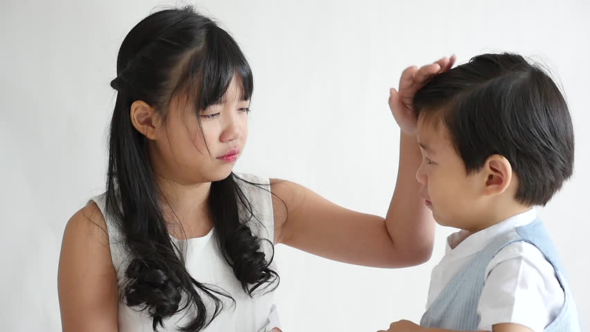 Asian children crying on white background,slow motion