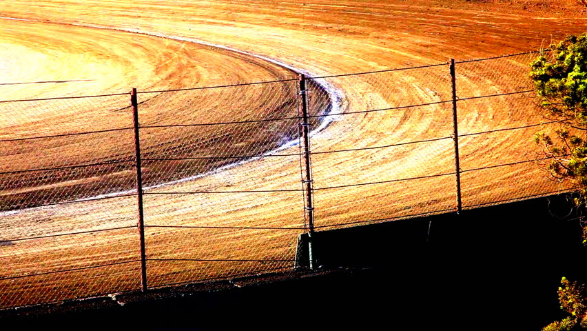 Cars Racing Around Dirt Track