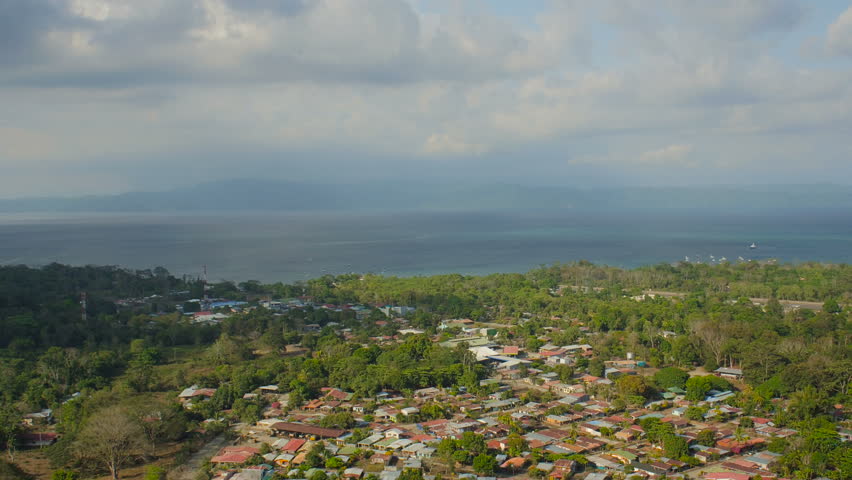 Costa Rica Aerial v17 Flying low over Puerto Jimenez town panning.