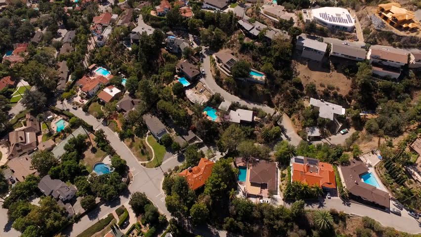 Glendale Aerial v2 Vertical shot flying over luxury neighborhood in the hills.