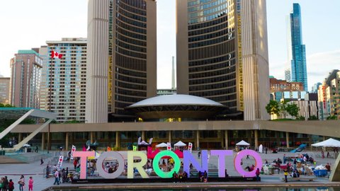 TORONTO - JUNE 12: 4k Timelapse of Toronto City Hall with big Toronto sign at Nathan Phillip Square, Toronto , Canada on June 12, 2016