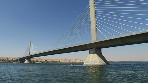 View of new Aswan bridge over Nile river from felucca boat