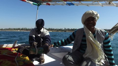 NILE, EGYPT - FEBRUARY 8, 2016: Nubian felucca sailing crew on trip on the Nile.