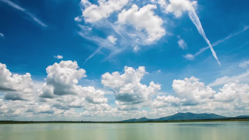 4K. Timelapse clouds over the water in the forest