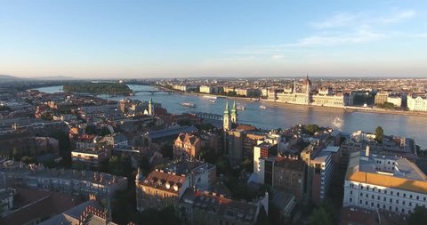Aerial footage taken from a drone shows the Hungarian Parliament and the river Danube in Budapest sunset.