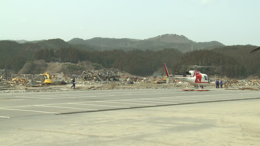 RIKUZENTAKATA, JAPAN - APRIL 1: Helicopter prepares for take off from tsunami
