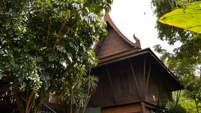 zoom in ancient thai houses thai architecture and tree around,popularity in during the early Ayutthaya period Siam Thailand 4k footage