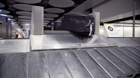 Baggage on luggage carousel at ,Heathrow Airport, London