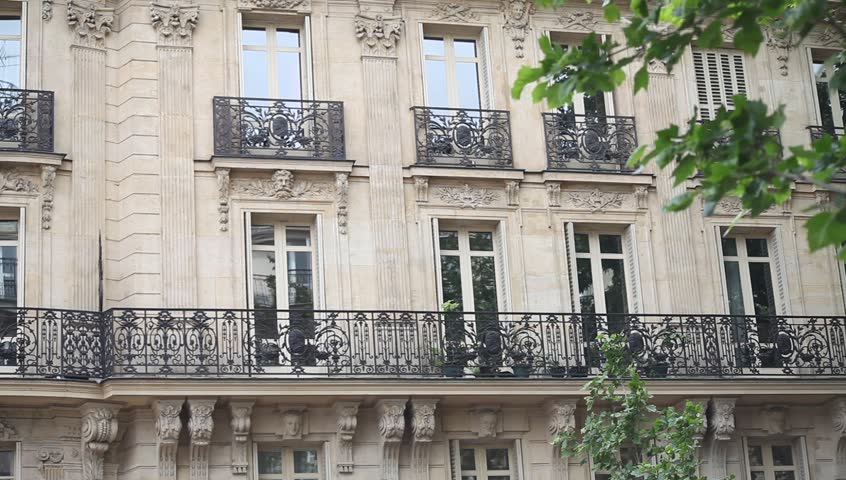 typical building exterior in Paris, establishing shot