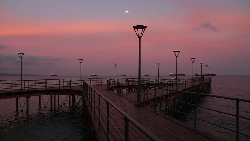Limassol (Lemesos), Cyprus - March, 2015: Park of modern sculpture, Coastline and promenade in Limassol, Mediterranean Sea at sunset. Ships anchored in port.
