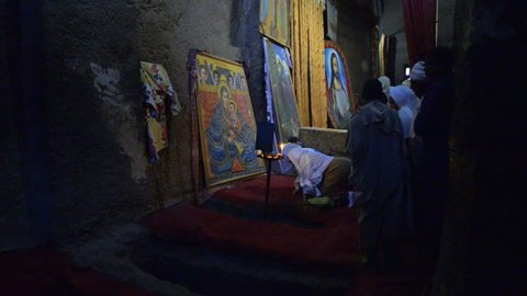 Lalibela, Ethiopia - January 5, 2015: Pilgrims praying in the church of Bete Medhane Alem in Ehtiopia, January 5, 2015.