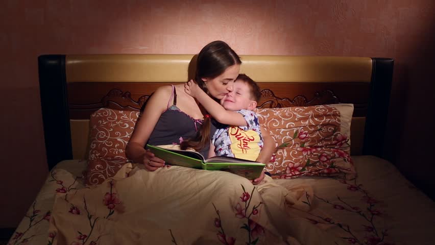 Mom Kisses and Putting to Bed Her Son at Home, in the Evening Shutterstock ...