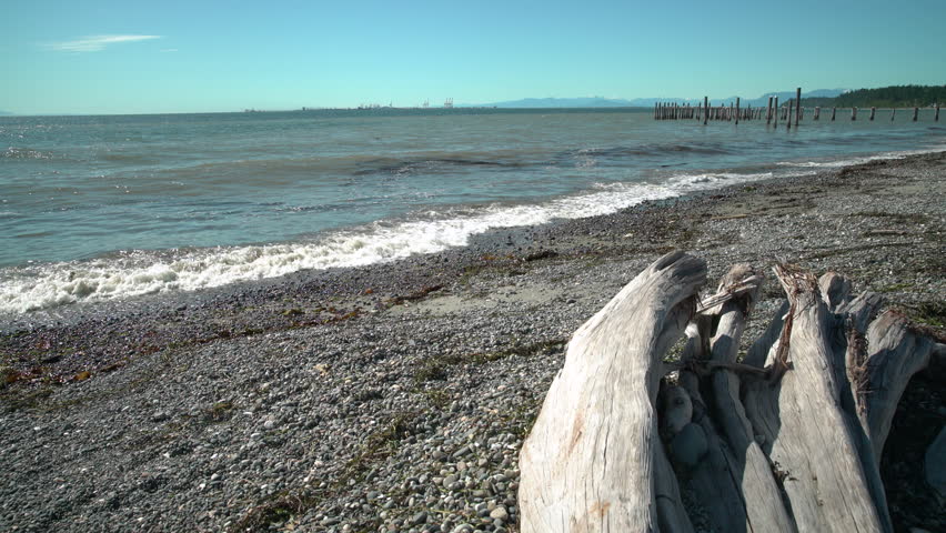 Point Roberts, Georgia Strait, Washington State. 4K UHD. The beach in Point Roberts, Washington State, looking out across Georgia Strait and north to Canada. USA.
