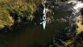 Kayaking on the river between the reeds