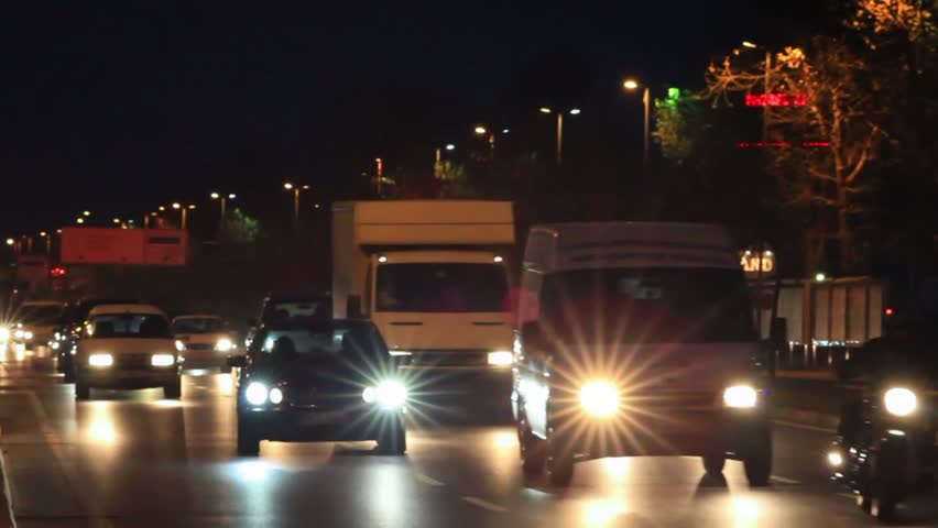 Halogen headlights. Traffic at night in Istanbul 