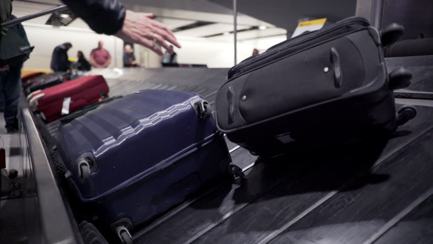 Baggage on luggage carousel at ,Heathrow Airport, London Royalty-Free Stock Footage #17559937