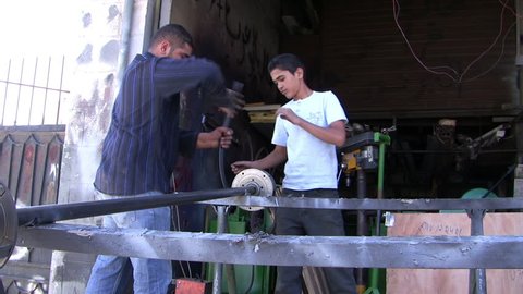 AMMAN, JORDAN - JUNE 11, 2009: An unidentified Blacksmith doing iron work, blacksmith doing his duty in Amman, Jordan on June 11, 2009.