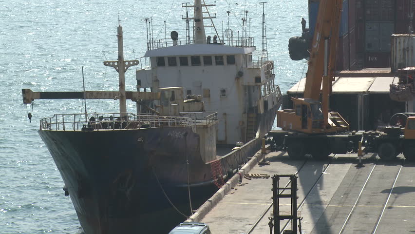 Crane loads cargo onto a ship in Hong Kong circa June 2010.