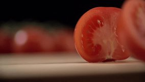 One tomato divided into two parts