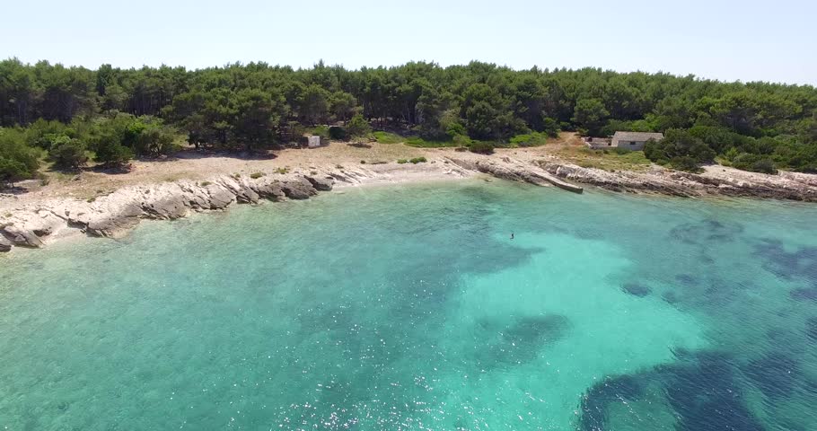 Aerial view of cozy mediterranean island.Blue lagoon, island paradise. Adriatic Sea of Croatia, Korcula, popular touristic destination.Proizd.Clear sea water | Shutterstock HD Video #17572594