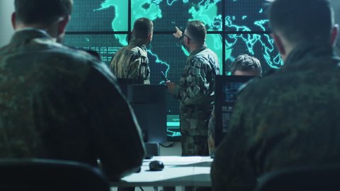 Group of Military IT Professionals on Briefing in Monitoring Room on Military Base. Shot on RED Cinema Camera in 4K (UHD).