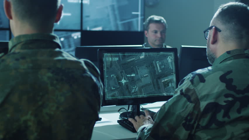 Group of Military IT Professionals in Monitoring Room on Military Base. Shot on RED Cinema Camera in 4K (UHD).