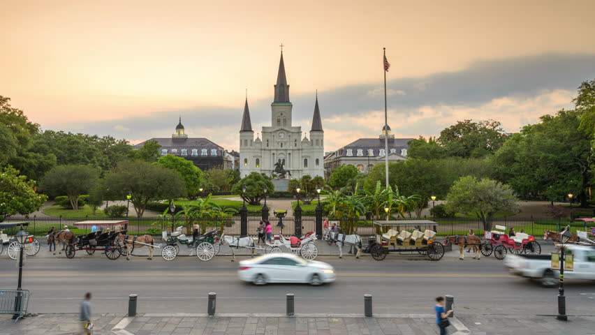 New Orleans, Louisiana, USA at St. Louis Cathedral and Jackson Square time lapse at dusk.