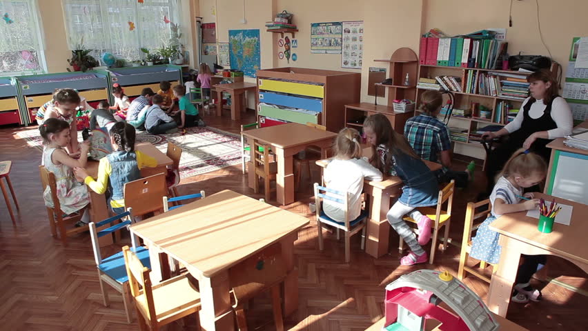 ST. PETERSBURG, RUSSIA - CIRCA MAY, 2015: Time lapse view of children drawing lesson in day-care center. Russian kindergarten is a daycare center for preschool kids