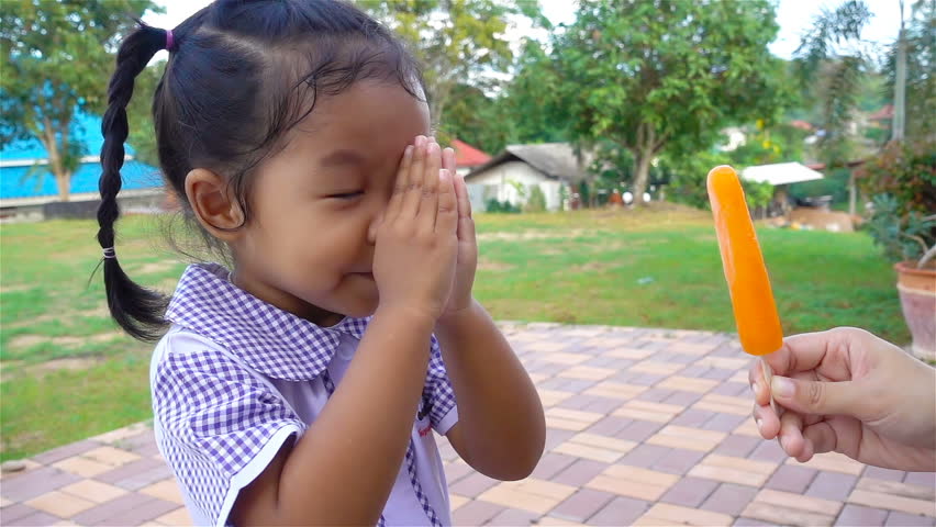 Slow motion, little cute girl using Thai style greeting of respect