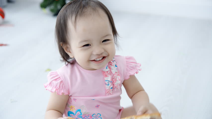 Happy Asian girl at home