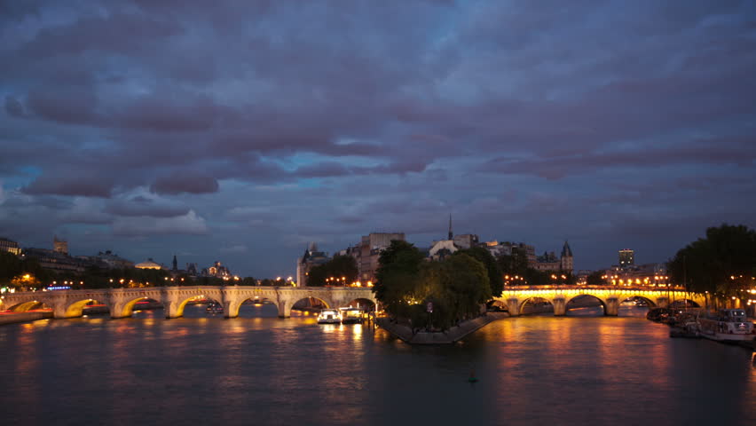 Pont Neuf bridge over the river Seine in Paris timelapse at night