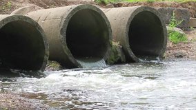 Concrete pipe from which the wastewater flows. Environmental pollution.
