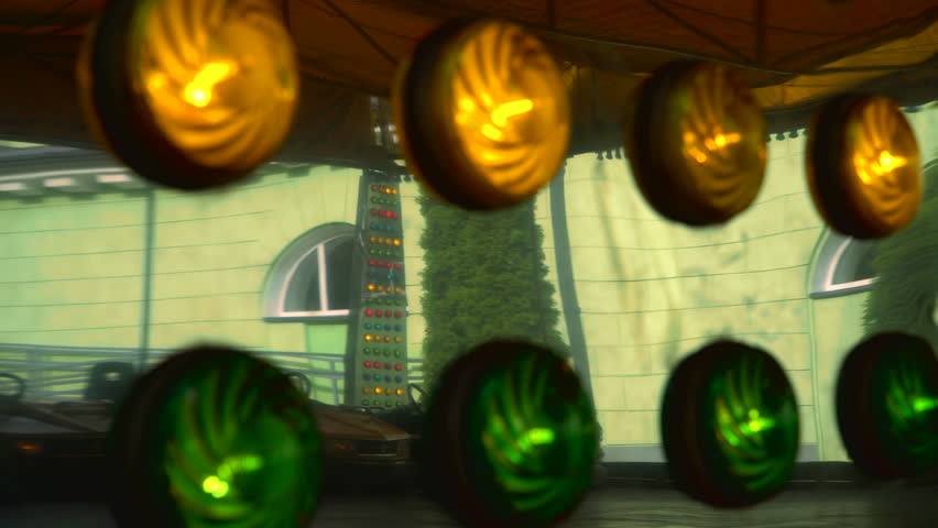 The reflection of people who is riding electric bumper cars