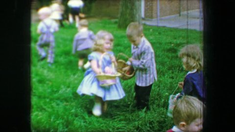 JUPITER, FLORIDA 1967: Easter egg hunt in long green thick grass in Sunday's best clothing.