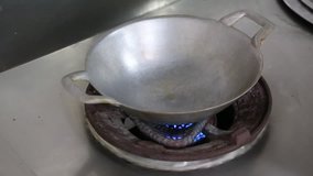 Pouring oil into frying pan