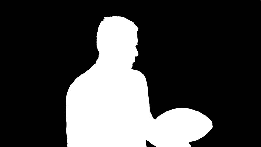 Man Throwing Football and Posing Silhouette
