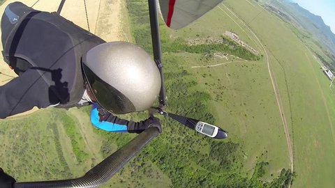 Man flying on a sport topless hang-glider