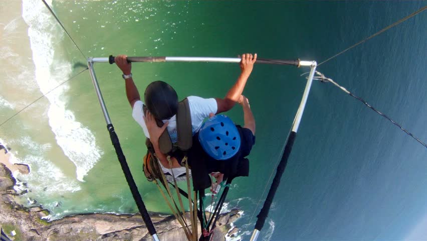 Hang glider flying over beach