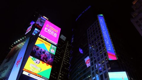 NEW YORK CITY - MAY 05:
Bottom view of Times Square Skyscrapers with billboards at night.
May 05, 2016 in NYC, New York, USA.