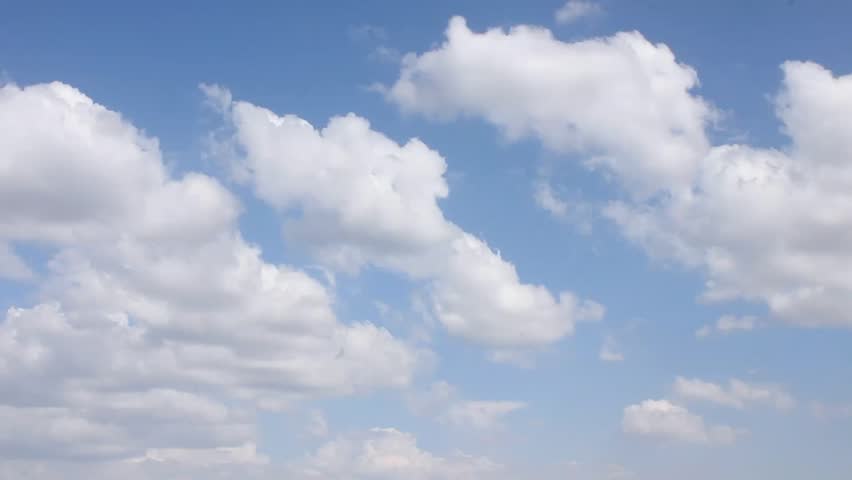Flight over clouds in clear blue soft skies, nature, real colours weather, building, formating mostly cloudy day.  FHD.