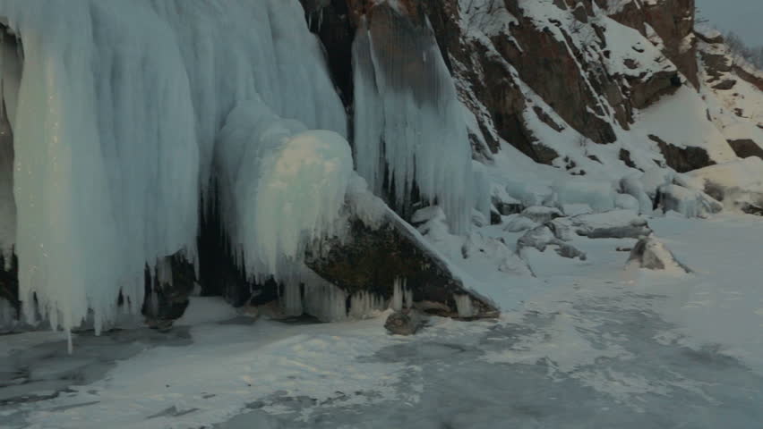 Huge icicles on rocks.