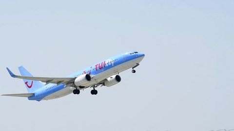 MUNICH, BAVARIA, GERMANY - JUNE 24, 2016: Boeing 737  of airline TUI while take-off at international airport in Munich