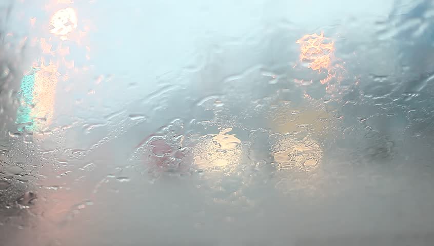 Bad weather, rain on the road. Wet slippery road, rain drops on the windshield. Traffic in poor visibility. Royalty-Free Stock Footage #17627521