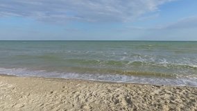 Sea view video. Sandy Beach. Shells sand. Blue sky. Steady video. Smooth video. Steadicam shot. 