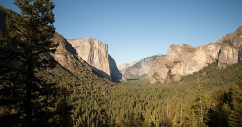 Yosemite National Park, California, USA - view of Yosemite valley with El Capitan and Bridalveil Fall from Tunnel View before sunset with shadows - Timelapse with motion and zoom in - August 2013