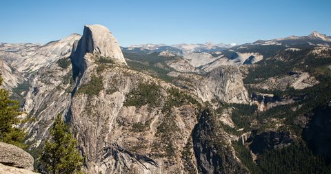 Yosemite National Park, California, USA - view of Yosemite valley with Half Dome from Glacier Point with blue clear sky and moving shadows - Timelapse with zoom out - August 2013
