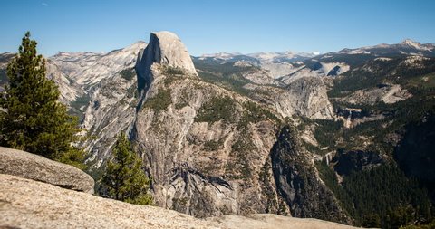 Yosemite National Park, California, USA - view of Yosemite valley with Half Dome from Glacier Point with blue clear sky and moving shadows - Timelapse with zoom in - August 2013