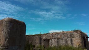 Clouds fly over the fortress. Russia. Kronshtadt. Abandoned Fort Alexander Shanets - Powered by Shutterstock - Get 15% off with code: PIKWIZARD15