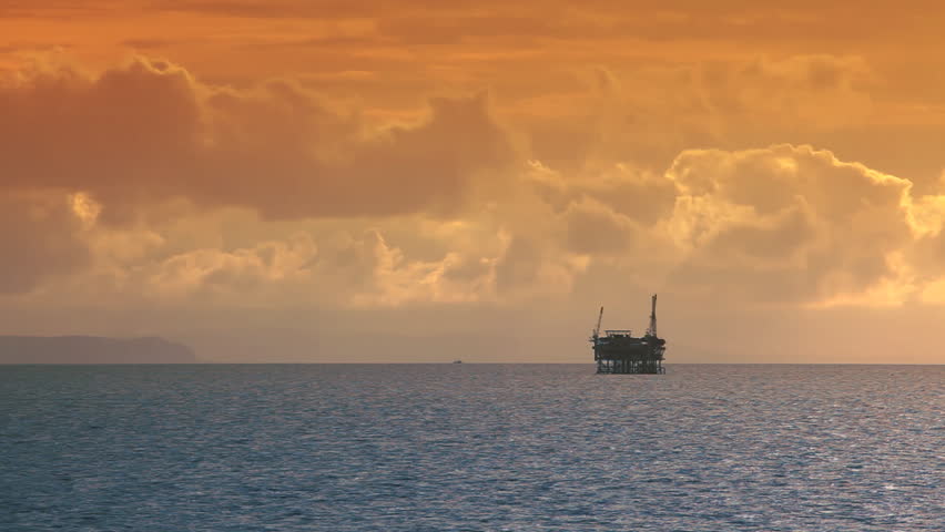 Ocean Sunset - Oil Rig Drilling Platforms on Horizon